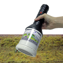 Load image into Gallery viewer, WWScenics Pro Grass Grand Static Grass Applicator held over a textured model grass surface for realistic 3D grass effect