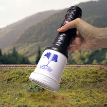 Load image into Gallery viewer, WWScenics Pro Grass Micro Static Grass Applicator held over a miniature landscape for detailed model grass application
