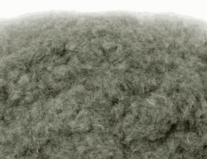 Close-up of WWScenics 2mm Melting Snow static grass fibers for miniature winter terrain modeling